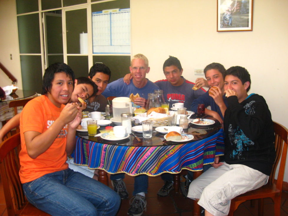 Justo enjoying a meal during a youth camp.